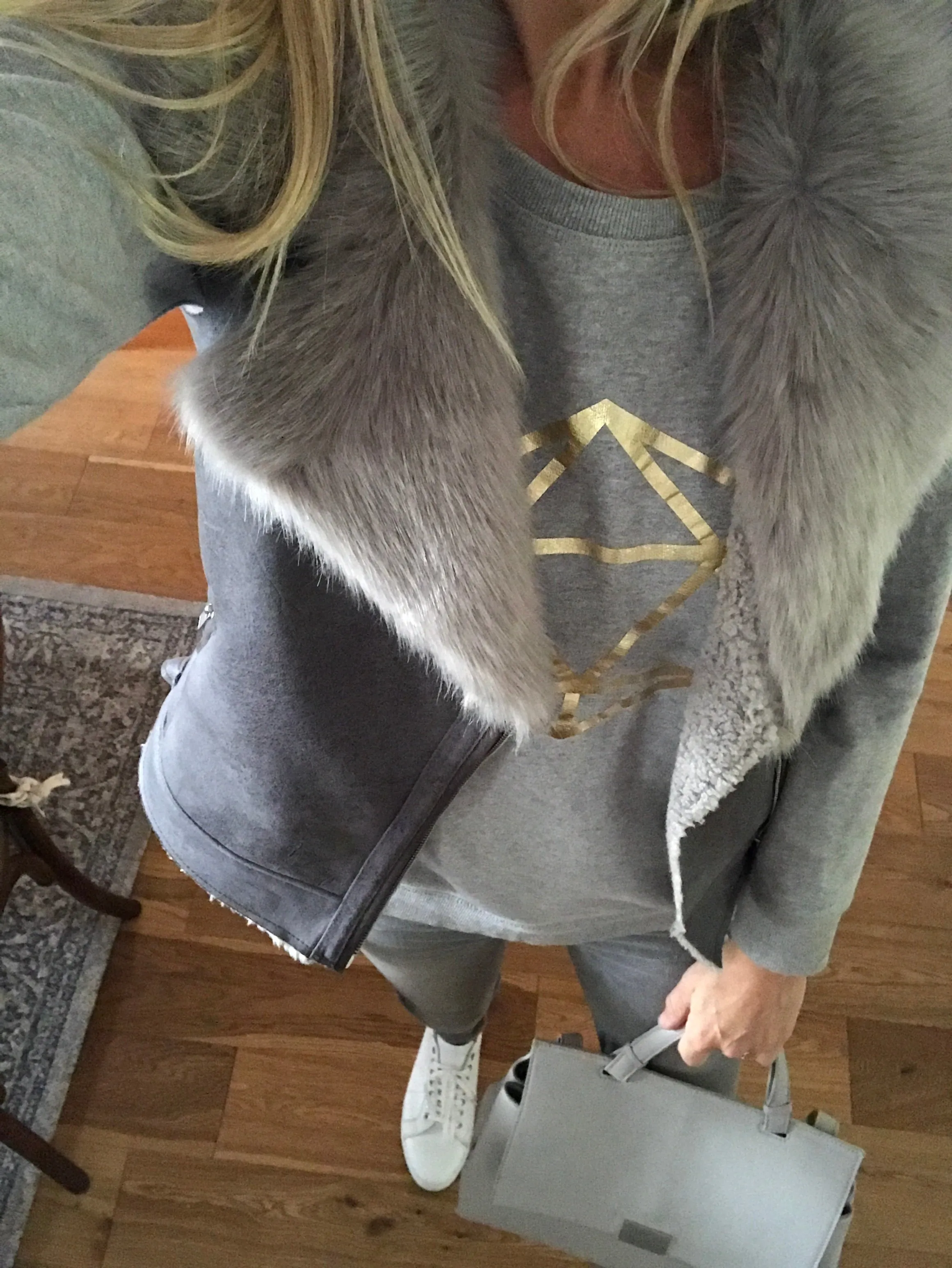 Metallic gold octahedron on a light grey sweat