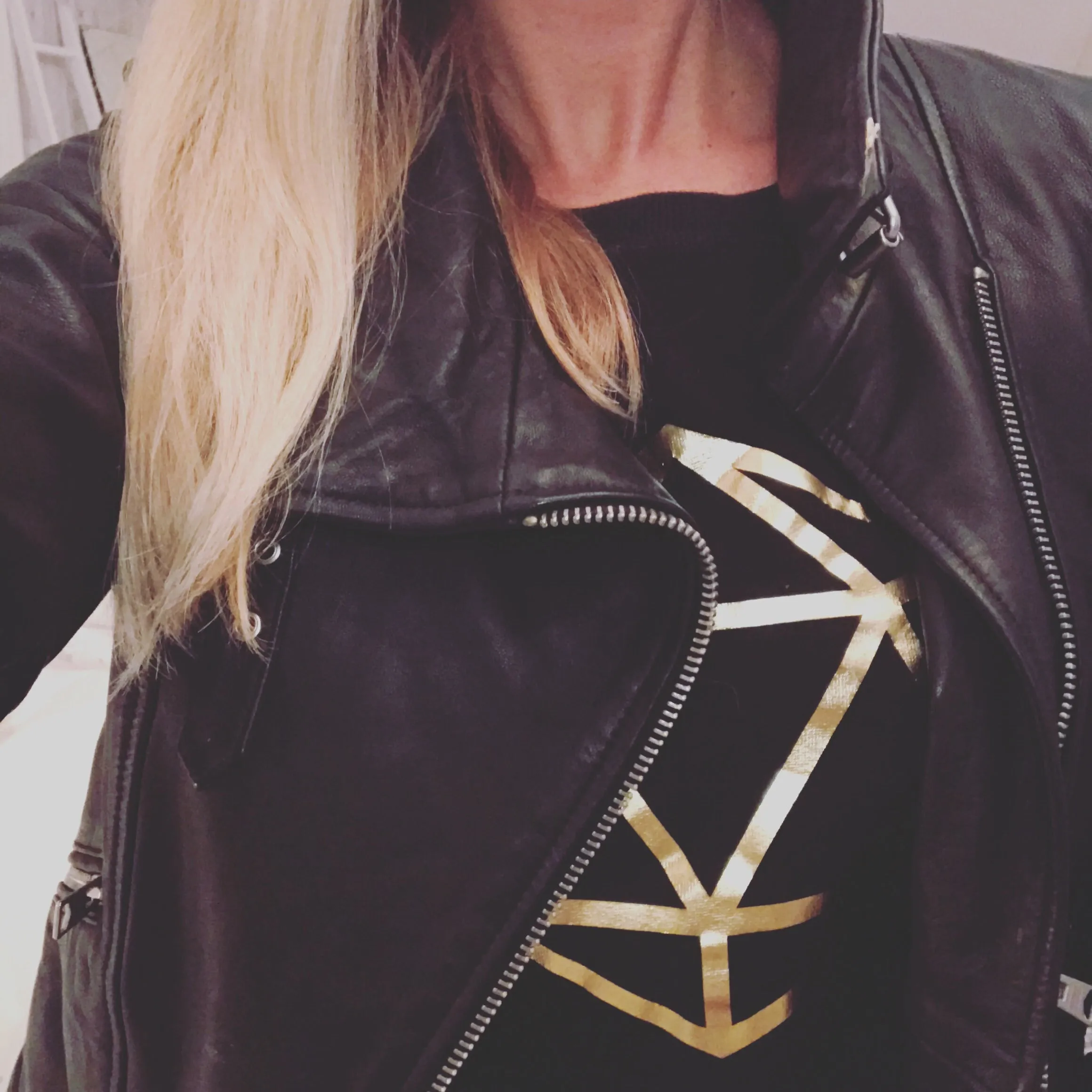 Metallic gold octahedron on black sweat